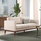 A pleated skirt nearly completely conceals the feet. Sarah 77 Square Arm Sofa Bed Joss Main