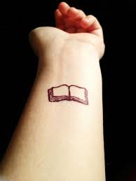 Small And Pretty Book Tattoo On Arm Tattoos Hand Tattoos Book Tattoo