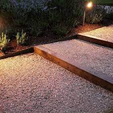 Oak Sleepers And Everedge Metal Edging Contain The Breedon Gravel All Illuminated By Hunza Lights Design Metal Landscape Edging Garden Stairs Landscape Design