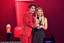 Addison Rae and Tanner Buchanan lock lips while presenting Best Kiss at the  MTV Movie & TV Awards