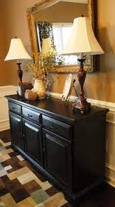 Three cabinets and an expansive surface serve your entertaining needs exceptionally well. 5 Tips How To Decorate With Buffet Lamps Fine Home Lamps Dining Room Console Dining Room Buffet Buffet Table Decor