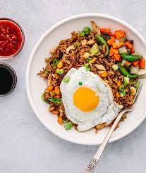 Nasi Goreng The Popular Indonesian Fried Rice Nasi Goreng Recipe Rice Dishes Recipes Feel Good Food