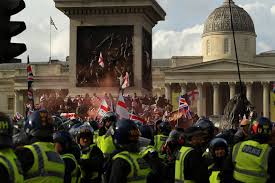 Police and protesters scuffle as 110,000 join anti-migrant London protest