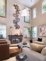 How To Decorate A Large Living Room To Make It Feel Cosy High Ceiling Living Room Living Room Orange Wall Decor Living Room