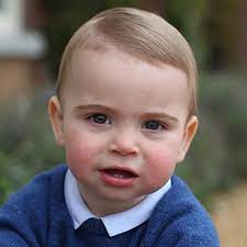 The picture shows the little royal perched on a red bike. Prince Louis Birthday Christening Royal Family Biography