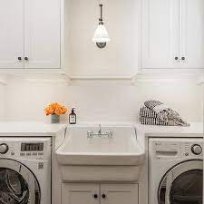 I cover the best compact 24 washer dryer models, electrical considerations, cabinet placement, counter tops & shut off valve options and door clearance. Sink Between Washer And Dryer Design Ideas