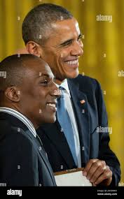 President Barack Obama poses with Andre Dubois, accepting the Presidential  Medal of Freedom for the late Rep. Shirley Chisholm from New York, her  grandnephew, Tuesday, Nov. 24, 2015, during a ceremony in