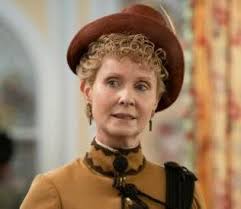 It was the unspoken rule that no unmarried young woman should wear a tiara.  Usually a small crescent diamond moon or a few small scattered stars over  the hair will be enough.