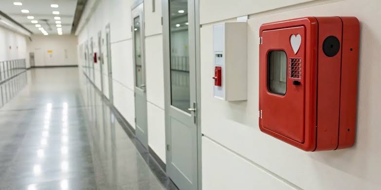 Expert advising on AED wall mount placement