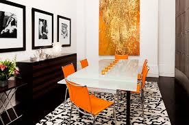 These chairs are spill friendly due to their easy to clean faux leather covers. 25 Trendy Dining Rooms With Spunky Orange