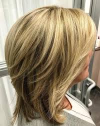 This top notch hairstyle is attributed with a layered look and a blend of black and blonde color. 80 Best Hairstyles For Women Over 50 To Look Younger In 2021