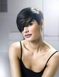 Long Sweeping Layers Worn With Asymmetric Fringes Over One Eye And Undercut At The Short Hair Styles Short Hair Styles For Round Faces Trendy Short Hair Styles