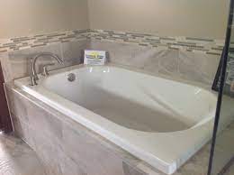 No matter what your choice is, enhancing the look of your hot tub is a must since it will the major focal point of your outdoor space. Drop In Tub With Gray Tile Drop In Tub Tile Tub Surround Tub Remodel