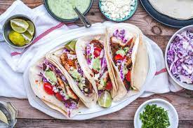 On a shallow plate, combine coconut flour, arrowroot powder, salt, pepper and paprika, stir with a fork to combine. Smoky Fish Tacos With Tangy Slaw And A Coconut Lime Cilantro Sauce Olive Mango