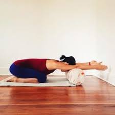 Adho Mukha Virasana Or Child S Pose With A Bolster Yoga Moves Iyengar Yoga Restorative Yoga