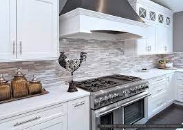 A backsplash can be an excellent focal point, but it can also be used to feature other parts of the kitchen, such as the countertops. White Modern Subway Marble Mosaic Contemporary Design Style Kitchen Design White Modern Kitchen Popular Interior Design