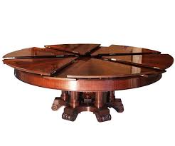 A circular dining table that expands when rotated. Round Dining Table That Expands