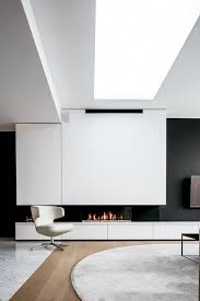 The planked walls in this open, sunny room were painted white to create an airy living room. 25 Minimalist Living Rooms That Are Pure Chic Shelterness