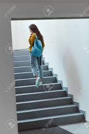 Maybe you would like to learn more about one of these? Rear View Of Schoolgirl With Backpack Walking Upstairs Stock Photo Picture And Royalty Free Image Image 110818362