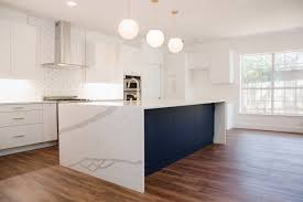 A waterfall is when the counter material continues down the sides of the cabinets, usually on both ends—but it can be on just one—creating a cascading effect with the countertop material. Waterfall Edges The Pros And Cons Of Choosing A Waterfall Countertop Edge Skelly Home
