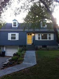 What kind of siding does a yellow house have? Blue House With Yellow Door Novocom Top