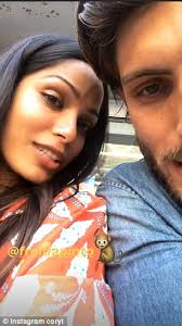 Freida Pinto looks chic in a red-and-white dress at the US Open