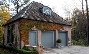 Carriage house steel garage doors offer embossed, high tensile steel panels that give the look of wood with the strength of steel. 20 Traditional Architecture Inspired Detached Garages Home Design Lover