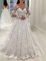 Prezioso ed intramontabile regala alla sposa femminilità rendendola più seducente nel giorno pizzi geometrici che saliranno e si arrampicheranno lungo le maniche arricchendole di romantica geometria in un gran intrinseco di forme. Abito Lungo Scollo A V Con Scollo A V A Grana In Pizzo Maniche Lunghe Abito Da Sposa Elegante In Tulle Bianco Vestito Maxi Vestito
