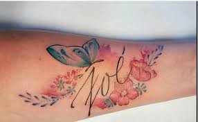 It is not uncommon to see butterfly tattoos with flower designs. Watercolor Flowers And Butterfly Tattoo With Name