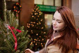 A wide variety of christmas tree shop options are available to you, such as design style, size, and material. Woman Shopping For Christmas Tree At Store Stockphoto