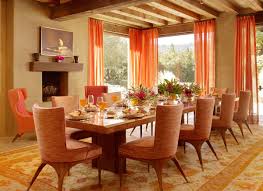 H&h style expert reiko caron plays up the layered, eclectic feel of a renovated dining room by accenting the walls with diy lights and art, adding a settee and using inexpensive accents. Dining Room Decorating Ideas Gorgeous Orange In The Dining Room Orange Dining Room Decorating Orange Dining Room Dining Room Cozy Interior Design Dining Room