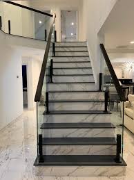 Glass Railing For A Marble Staircase Stairs Design Modern Staircase Design Modern Home Stairs Design