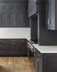 The dark grey cabinets contrast with the white countertops with a lot of decor drama taking place. Kitchen With Gray Cabinets Why To Choose This Trend Decoholic