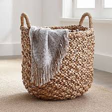 Amp up the texture in your living room with this cozy, woven throw. Decorative Storage Baskets Wicker Wire Rattan Crate And Barrel