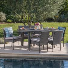 Noble House Kyle Grey 7 Piece Wicker Outdoor Dining Set With Grey Cushion 23441 The Home Depot Wicker Dining Set Outdoor Dining Set 7 Piece Dining Set