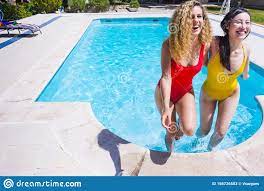 Young Interracial Girls Couple in the Pool Stock Image - Image of  enjoyment, diversity: 156726553