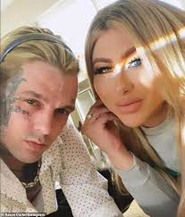 Aaron Carter 'is back on' with on/off fiancee Melanie Martin as he 'gushes'  about her