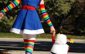This brite dress is designed with a white with pastel rainbow colored blue, yellow and pink stripes on her puffy sleeves, mesh skirt and top with pink jeweled buttons and bright fiber optic twinkle lights within her skirt. Rainbow Brite Costume Tutorial Thumb 50 Diy Halloween Costume Ideas Diy Crafts At Repinned Net