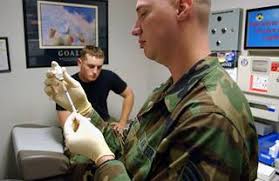 U.S. Air Force AIRMAN 1ST Class Casey Johnson, 8th Maintenance Squadron,  receives a mandatory Anthrax and