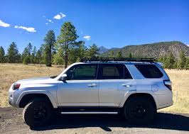 It includes black wheels, black body pieces, and black interior trimmings. Toyota 4runner Roof Racks Voyager Racks