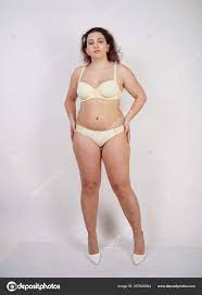Pretty Chubby Girl Wearing Fashionable Yellow Underwear Loves Her Body  Stock Photo by ©agnadevi 257825524
