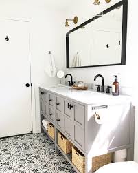 This look works particularly well when white cabinet doors and drawers are contrasted. Grey Vanity Black Fixtures Patterned Ceramic Tile Floor Master Bathroom Black Bathroom Grey Bathroom Vanity Bathroom Vanity
