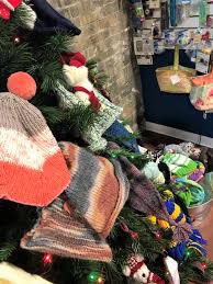 Who woulda' thought that mittens an' trees could be so much fun? Sheboygan Yarn Shop Collects Hand Made Hats Mittens For Needy Streetwise