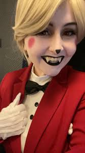 Here's who I'll be cosplaying this year. It's Charlie from Hazbin hotel.  I'm very excited to dress like her this. She so much fun and I can't wait  to see you guys