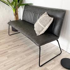 Generous scale makes room for one and all. Cleo Faux Leather Industrial Dining Bench Modish Living