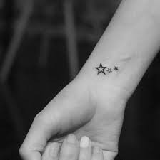 Star tattoo with a beautiful quote on behind ear is the best tattoo idea to get done on skin. Recycle T Ttoo The Meaning Of Star Tattoos Star Tattoos Small Star Tattoos Wrist Tattoos For Women