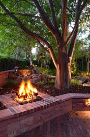 Nothing says cozy and comfortable like flames crackling in a backyard fire pit. Outdoor Gas Firepit In Denver Backyard Backyard Fire Deck Around Trees Fire Pit Backyard