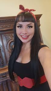 I am thrilled with my new hairstyle and headband, which channels the  classic Rosie The Riveter look. #rosietheriveter #pinuplook #pinupmodel  #rockabillystyle #rockabilly #retro #vintagestyle #carshowmodels  #classiccars