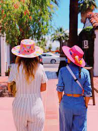 Girls Talk In Superbloom Hats In Palm Springs Hats Girl Pink