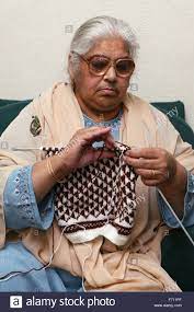 Free baby knitting patterns such as these are a great way to learn and refine knitting techniques. Download This Stock Image South Asian Lady Knitting F711pf From Alamy S Library Of Millions Of High Resolution Stock Photos I Asian Woman Knitting Fashion